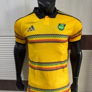 Adidas Jamaica 2026 x Bob Marley Home Authentic Jersey bold gold Reggae Boyz official kit front view showing iconic Bob Marley tribute design and authentic Jamaican football shirt