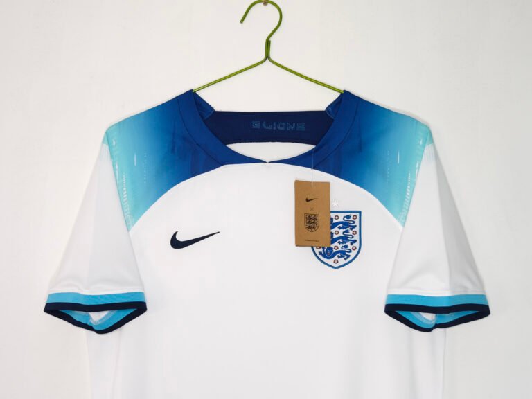 Football shirt size guide example showing an England home shirt